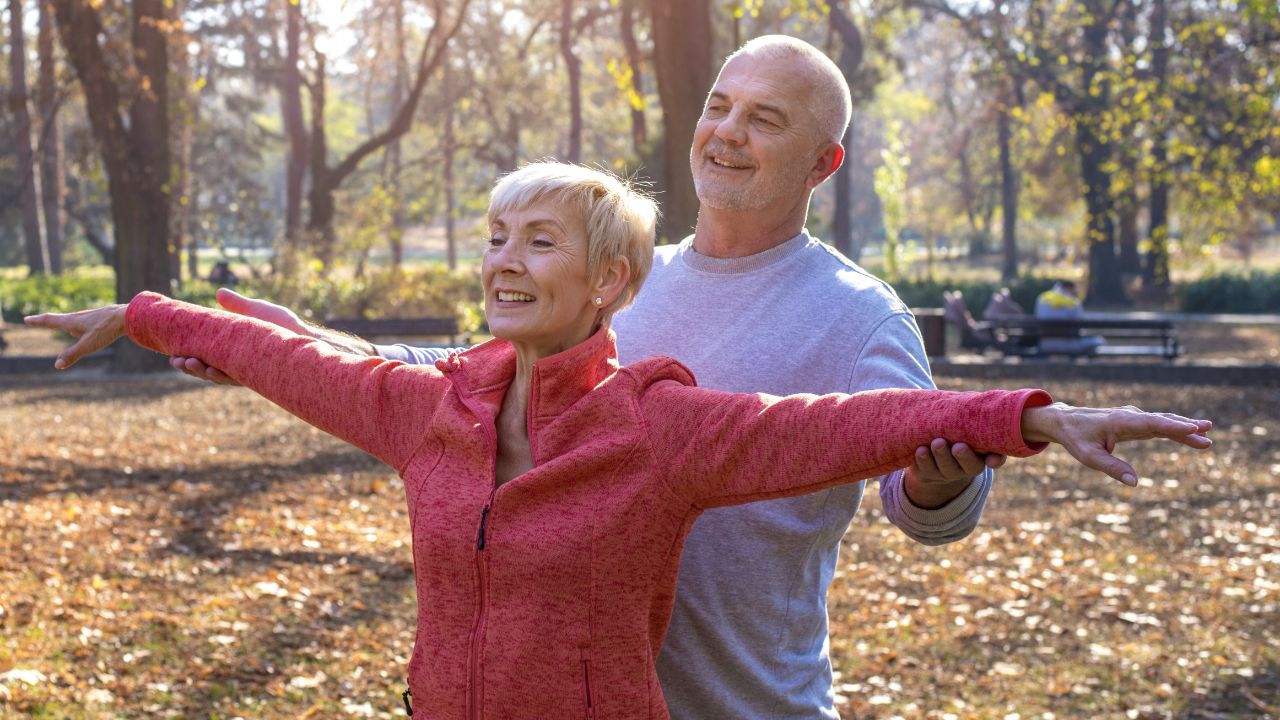 happy-elder-couple-exercising-park